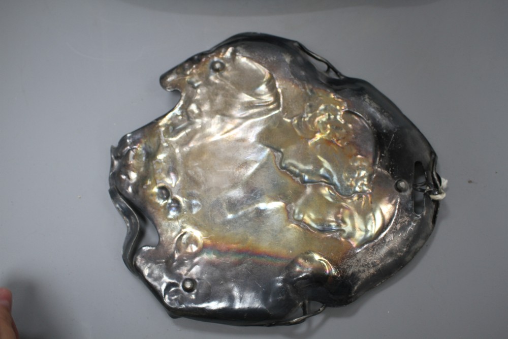 A WMF pewter tray, decorated with two maidens, 23cm, and another tray decorated with Diana hunting a stag, 41cm